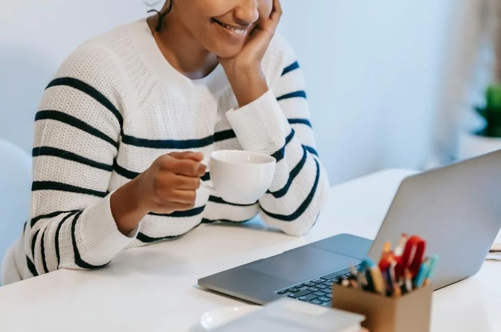 Woman smiling because she's having her most productive week.