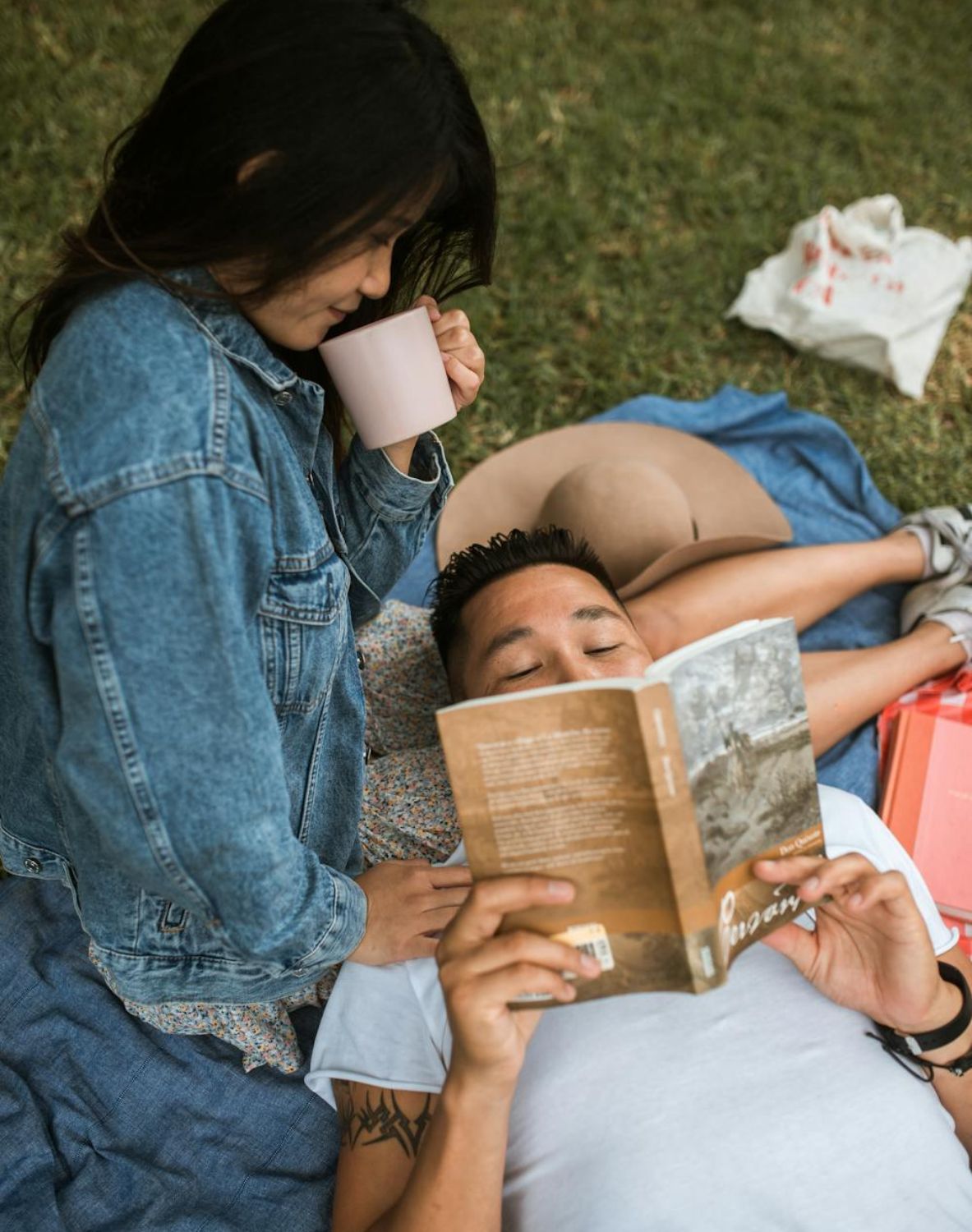 Asian couples asking themselves hot seat questions in a field