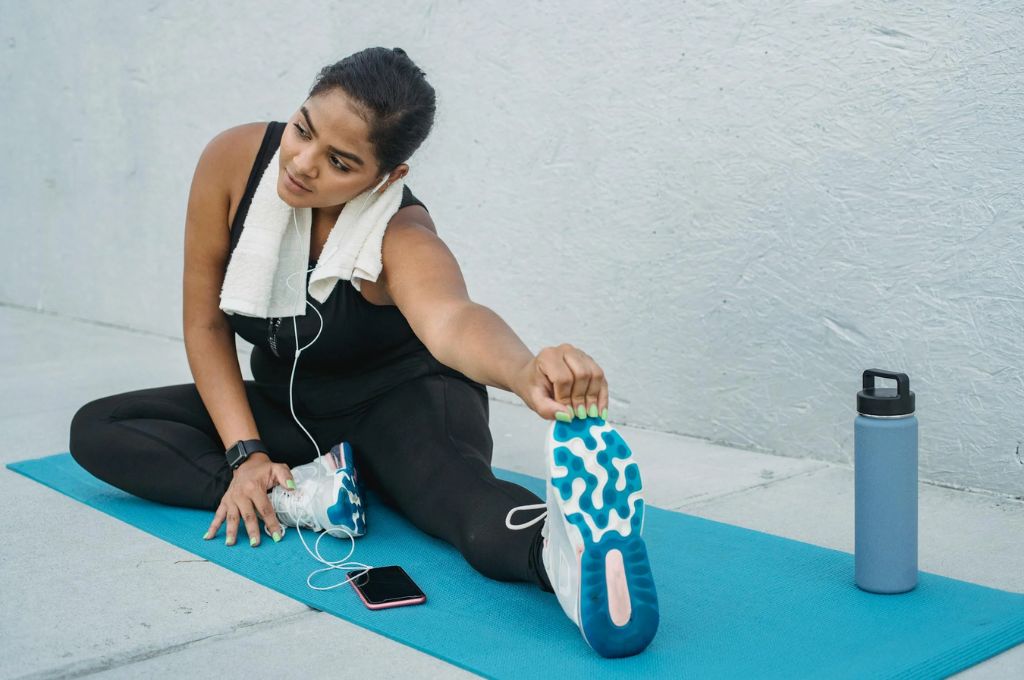 A woman working out as part of her new year's goal ideas